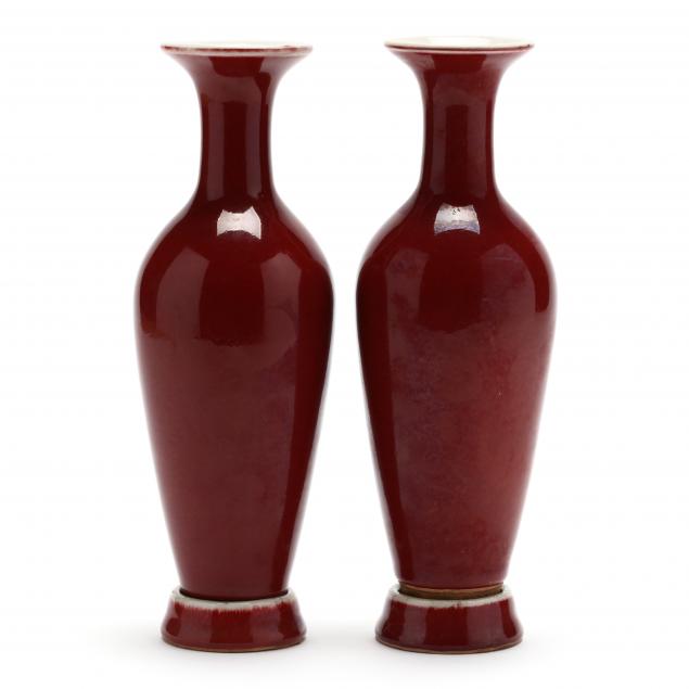 a-pair-of-chinese-porcelain-sang-de-boeuf-vases-with-stands