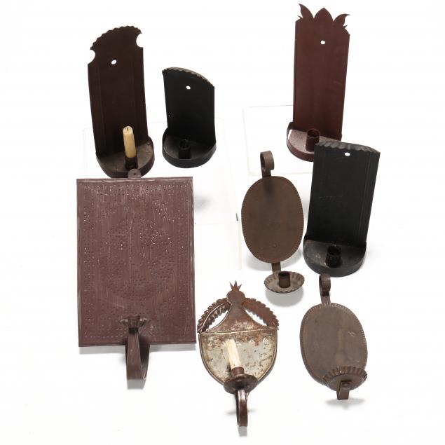 an-assortment-of-tin-candle-sconces