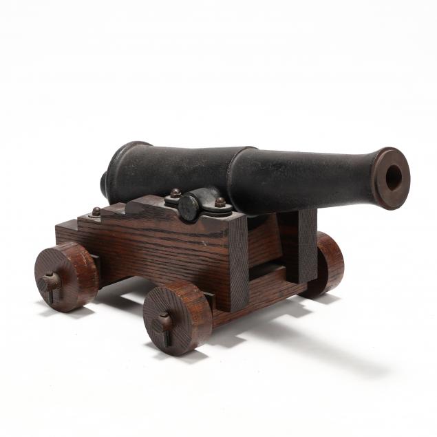 iron-signal-cannon-on-a-wooden-carriage