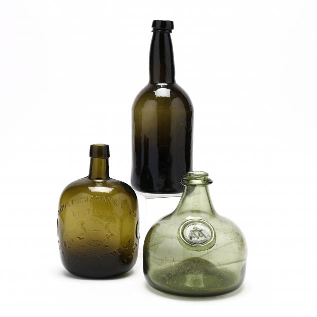 three-green-glass-bottles