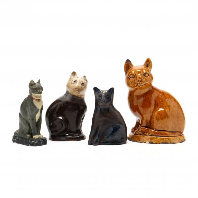 a-group-of-antique-cat-figurines