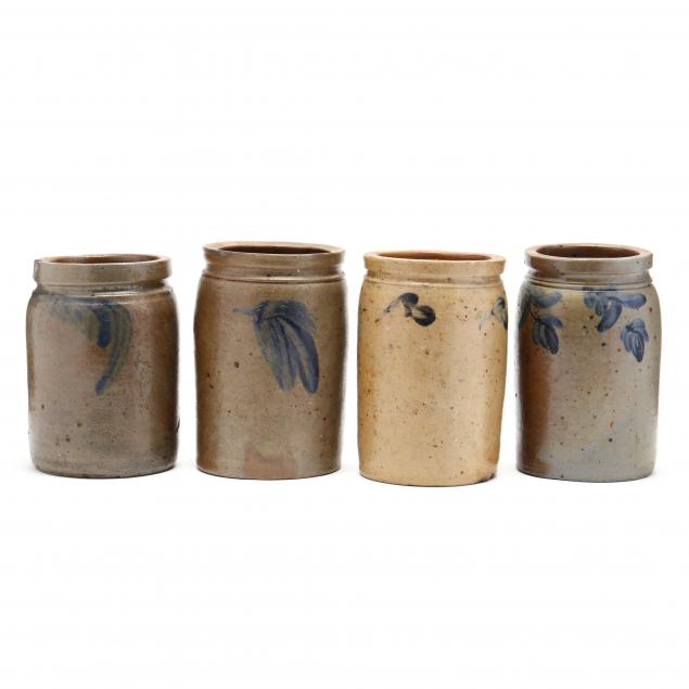 a-group-of-four-stoneware-jars
