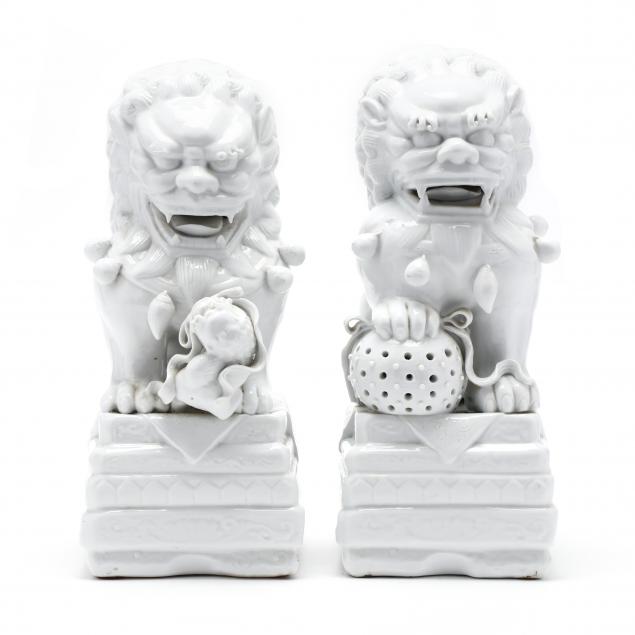 a-pair-of-blanc-de-chine-porcelain-foo-dogs