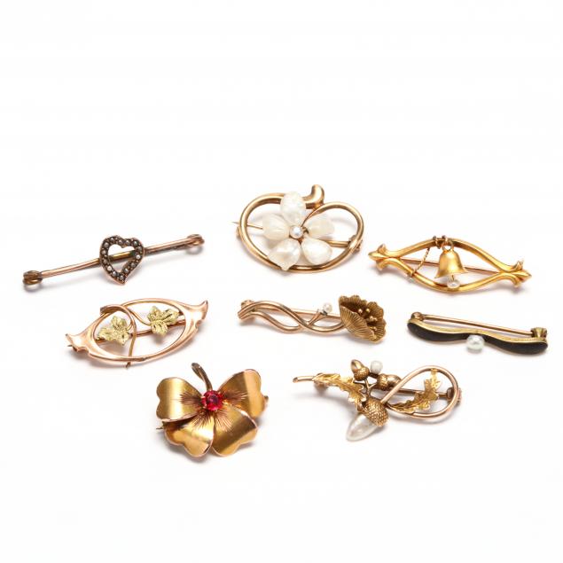 group-of-gold-brooches