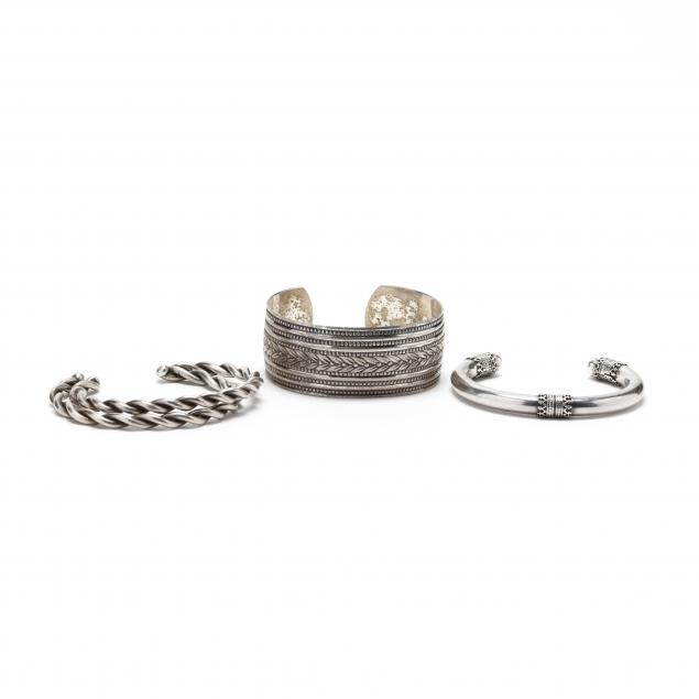 group-of-silver-cuff-bracelets