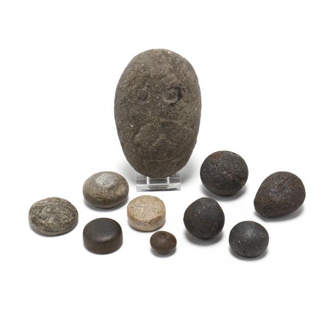 eight-gaming-stones-a-drilled-bead-and-an-enigmatic-effigy