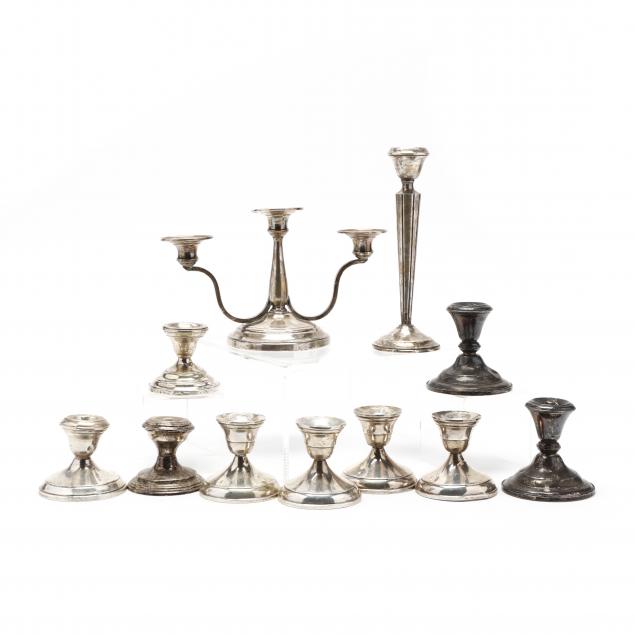 a-collection-of-sterling-silver-candlesticks