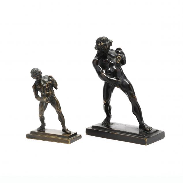 two-grand-tour-bronzes-of-a-satyr-with-wineskin