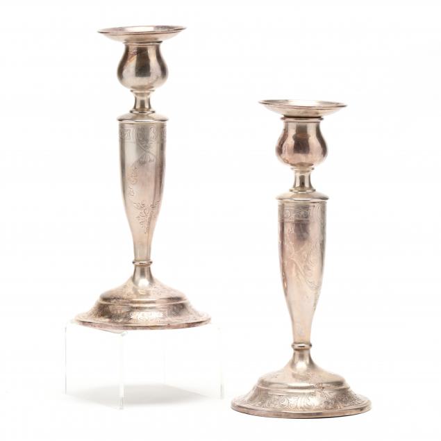 a-pair-of-sterling-silver-candlesticks