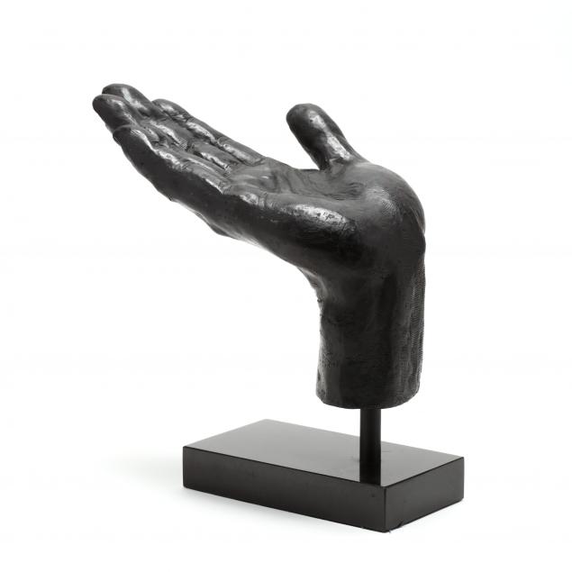 iron-sculpture-of-a-hand