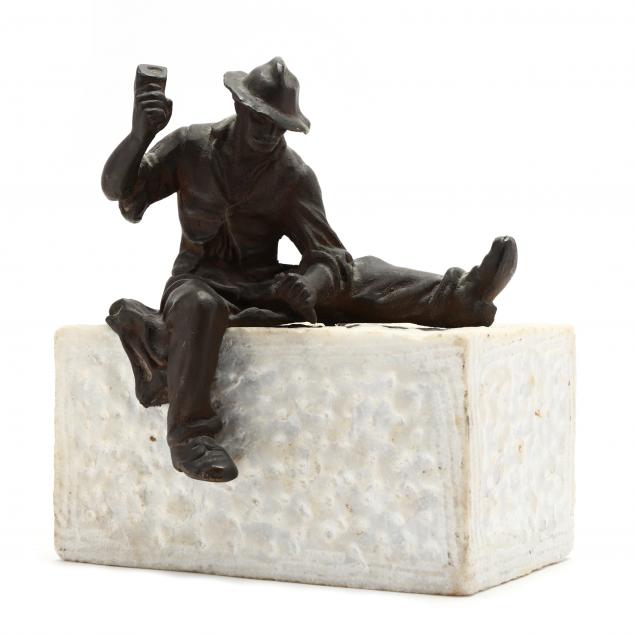 vintage-statue-of-a-man-chiseling-stone