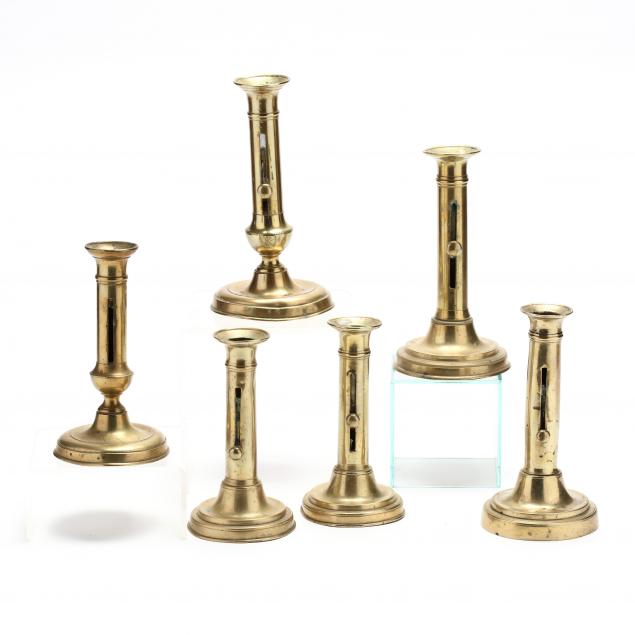 six-antique-brass-push-up-candlesticks