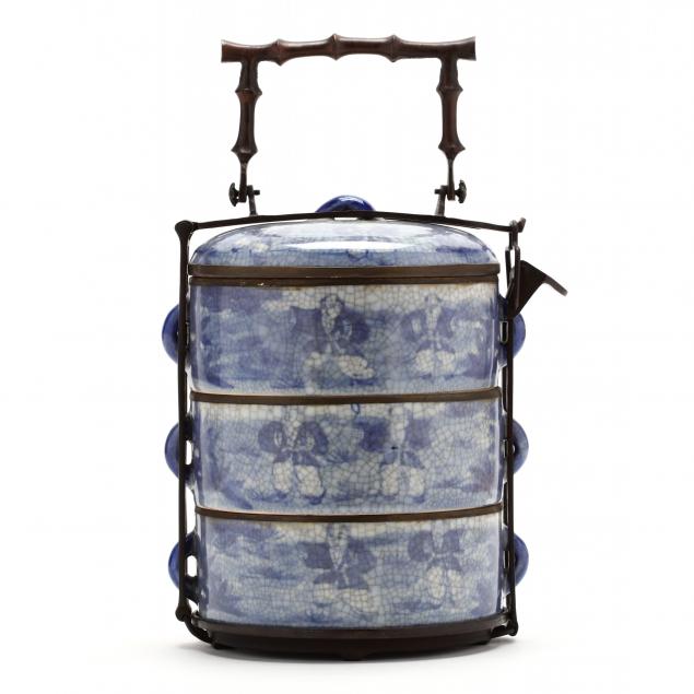 a-chinese-porcelain-stacked-container-with-carrying-holder