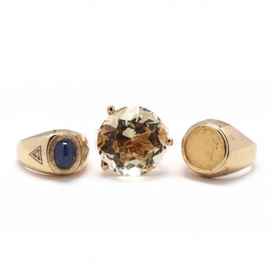 three-gold-and-gemstone-rings