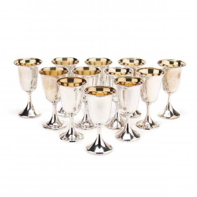 an-assembled-set-of-twelve-parcel-gilt-sterling-silver-goblets