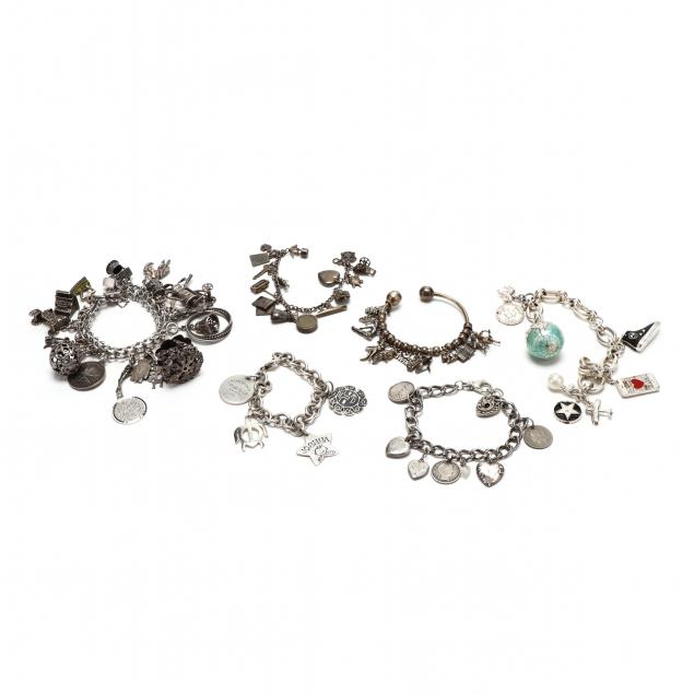 group-of-silver-charm-bracelets