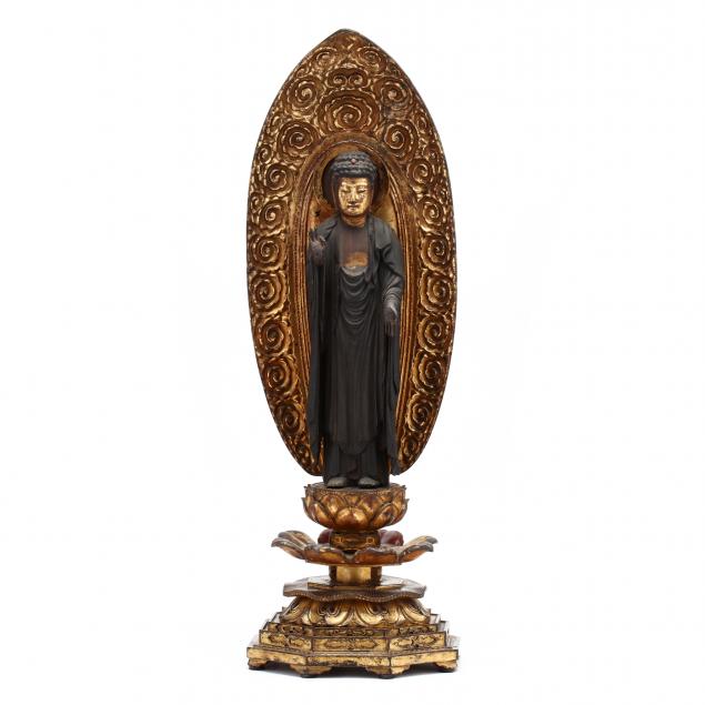 an-antique-carved-wooden-buddha-on-stand-with-mandorla
