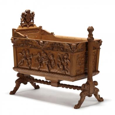 german-relief-carved-cradle-with-royal-crest