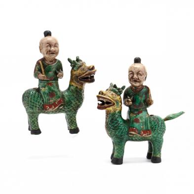 a-pair-of-chinese-sculptures-with-boys-riding-qilins