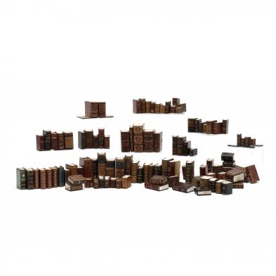 a-group-of-90-miniature-leatherbound-books-and-accoutrements