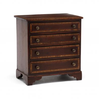 an-antique-english-inlaid-mahogany-miniature-chest-of-drawers