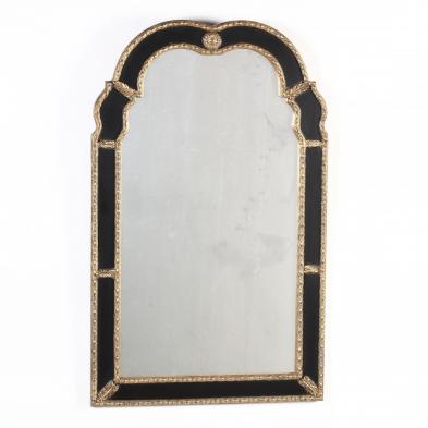 an-ebonized-gilt-queen-anne-style-mirror