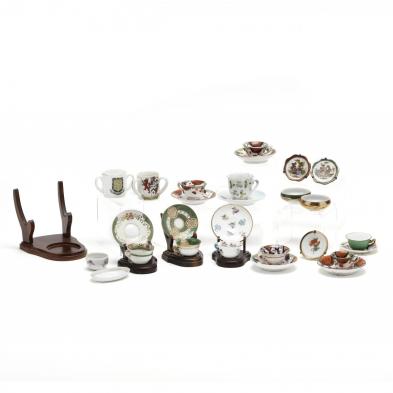 a-group-of-antique-miniature-cups-and-saucers