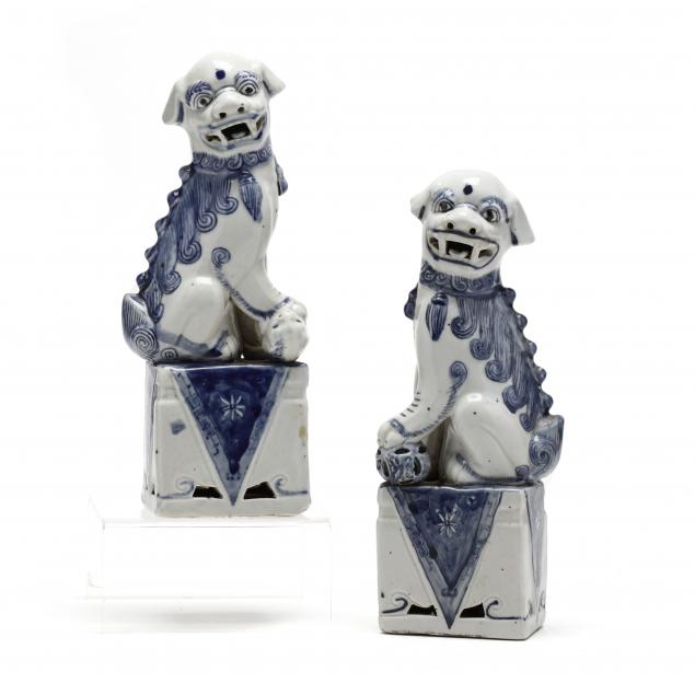 a-pair-of-chinese-blue-and-white-porcelain-foo-dogs