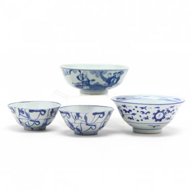 a-group-of-four-asian-blue-and-white-bowls