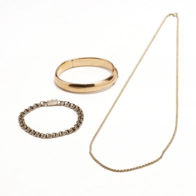 three-gold-jewelry-items