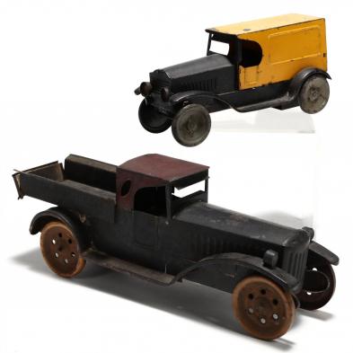 two-antique-pressed-tin-toy-trucks