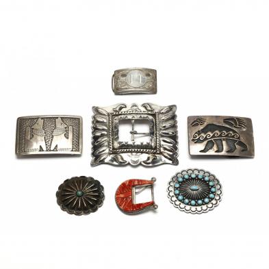 a-group-of-silver-and-gemstone-belt-buckles