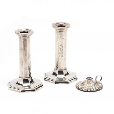 three-sterling-silver-candlesticks