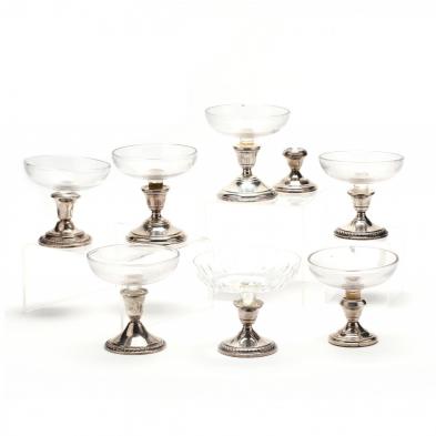 a-collection-of-sterling-silver-candlesticks-with-glass-compotes