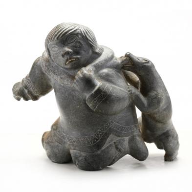 large-inuit-carved-stone-figure-of-man-with-bear
