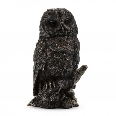 a-silver-clad-owl-sculpture