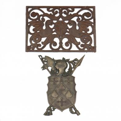 two-heraldic-cast-iron-plaques