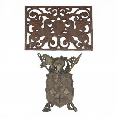 two-heraldic-cast-iron-plaques