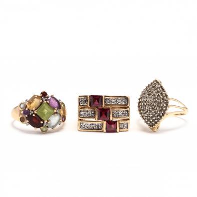 three-gold-and-gemstone-rings