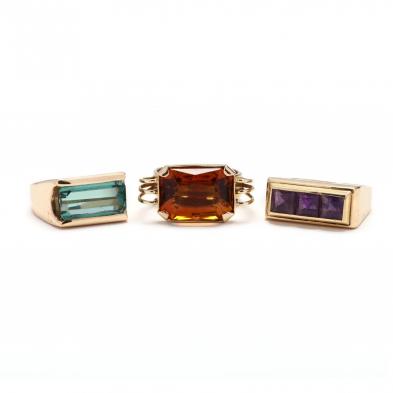 three-gold-and-gemstone-rings