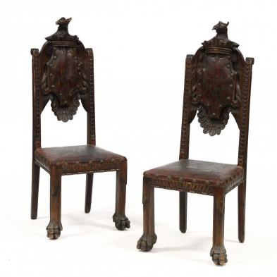 pair-of-continental-carved-coat-of-arms-side-chairs