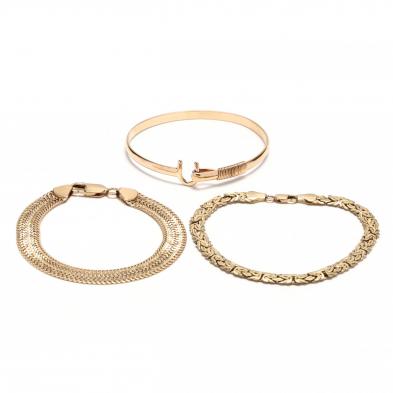 three-gold-bracelets