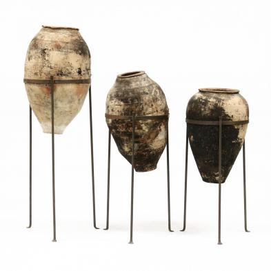 three-terracotta-amphora-vessels-on-stands