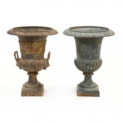 two-similar-cast-iron-garden-urns