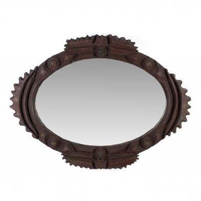 an-oval-tramp-art-wall-mirror