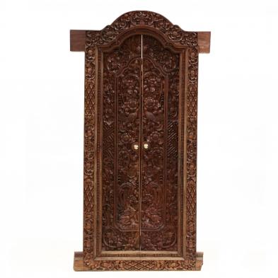 a-balinese-relief-carved-door-frame-with-doors