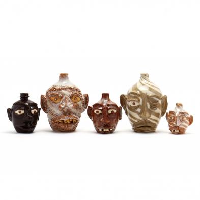 a-group-of-folk-art-pottery-face-jugs-g-f-cole