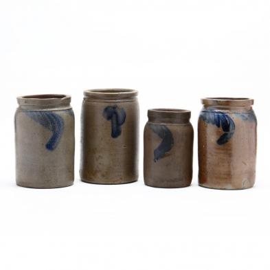 a-group-of-four-storage-jars