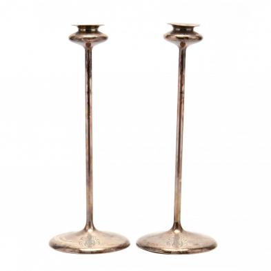 a-pair-of-tall-sterling-silver-candlesticks