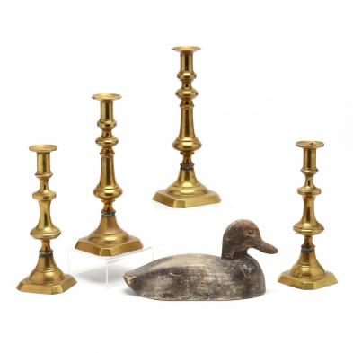 group-of-antique-brass-candlesticks-and-decoy
